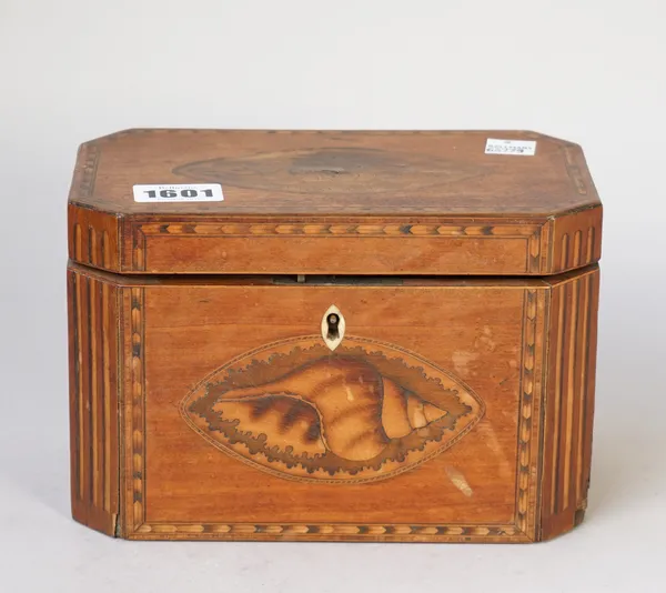 A George III mahogany tea caddy of compressed octagonal form with twin lidded interior, 19cm wide x 12cm high.