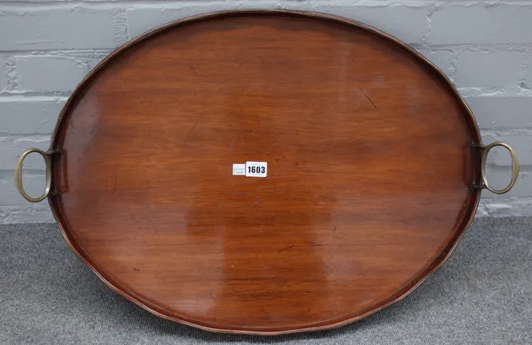 A George III brass bound mahogany oval serving tray, with wavy gallery, 70cm wide.