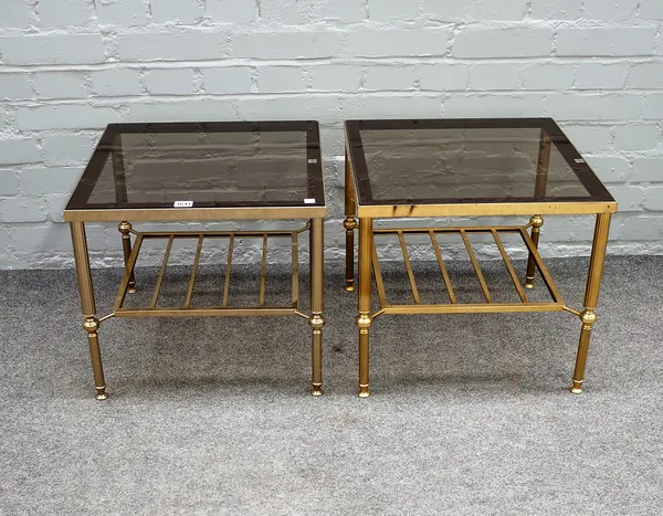 A pair of mid-20th century lacquered brass and smoked glass square occasional tables on reeded supports, 46cm wide x 41cm high.