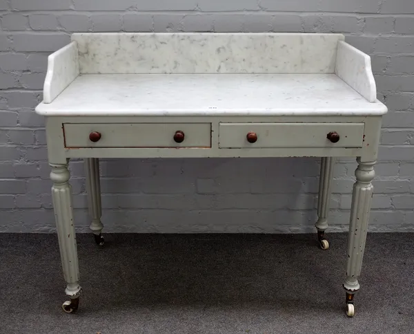 A William IV later painted marble top washstand, with pair of frieze drawers, on reeded supports, 107cm wide x 91cm high.