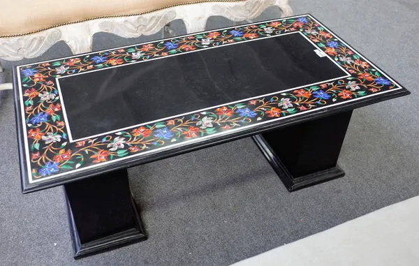 A 20th century marble coffee table, the rectangular top chased with specimen marble floral inlay on pair of square pedestals, 122cm wide x 49cm high.