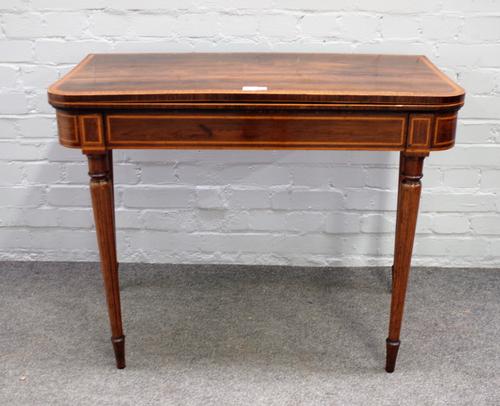 A George III rosewood card table, with satinwood crossbanded top, on box strung tapering legs, 91cm wide x 71cm high.