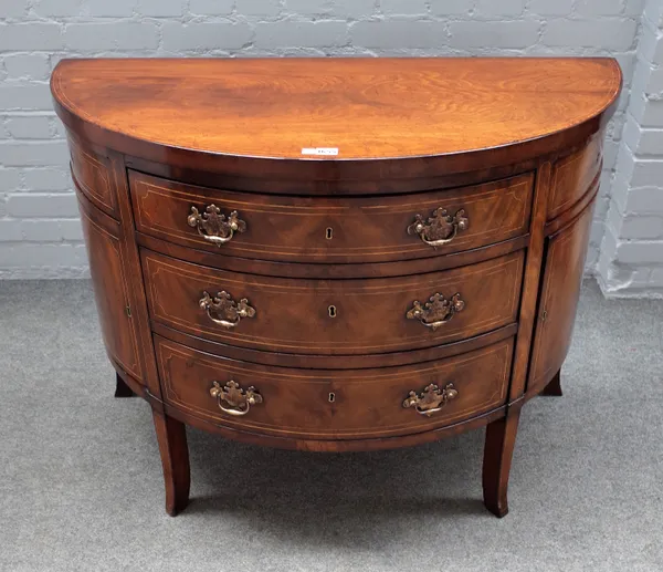 An 18th century inlaid mahogany demi-lune side cabinet, with three drawers flanked by cupboards, on splayed supports, 106cm wide x 79cm high.