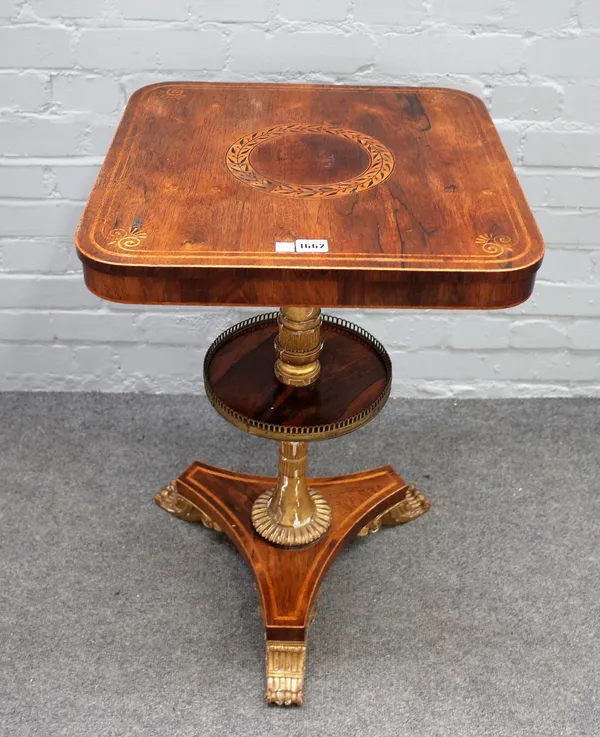 A Regency rosewood parcel gilt two tier etagere, on three scroll feet, 49cm wide x 72cm high.