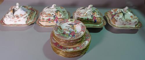 A Chinese export ware part dinner service decorated in the famille rose style with figures, (qty).