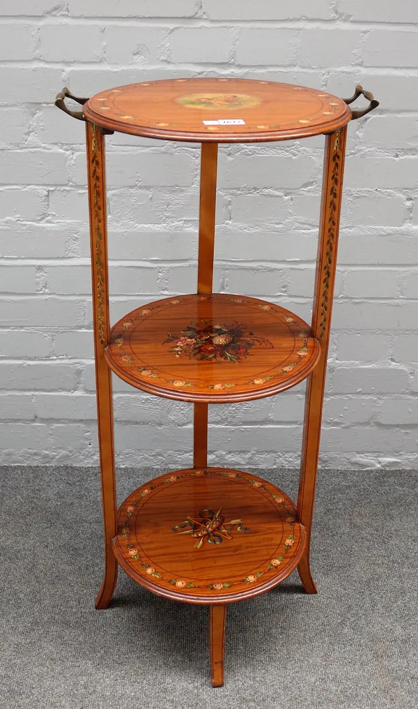 An Edwardian painted satinwood three tier etagere, on splayed supports, 45cm wide x 91cm high.