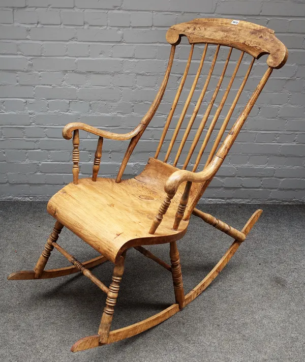 A 19th century Swedish beech and pine rocking chair on turned supports, 56cm wide x 118cm high.