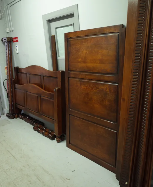 Harrods by The Royal Oak Furniture Company;  a 17th century style oak four poster bed with panel canopy, head and footboard and turned supports, 182cm