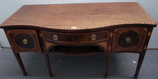 A George III inlaid mahogany serpentine sideboard, with three frieze drawers over tambour panel, on tapering square supports, 167cm wide x 89cm high x