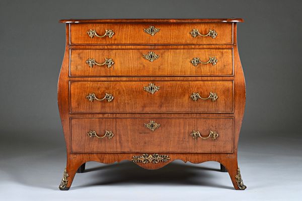 A 19th century Dutch walnut commode, the serpentine top over a bombe four drawer base on splayed bracket feet, 86cm wide x 79cm high.