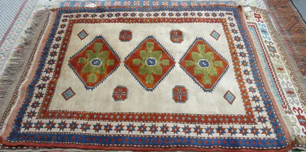 A modern Turkish rug, white with three medallions, of Caucasian design, 170cm x 129cm.