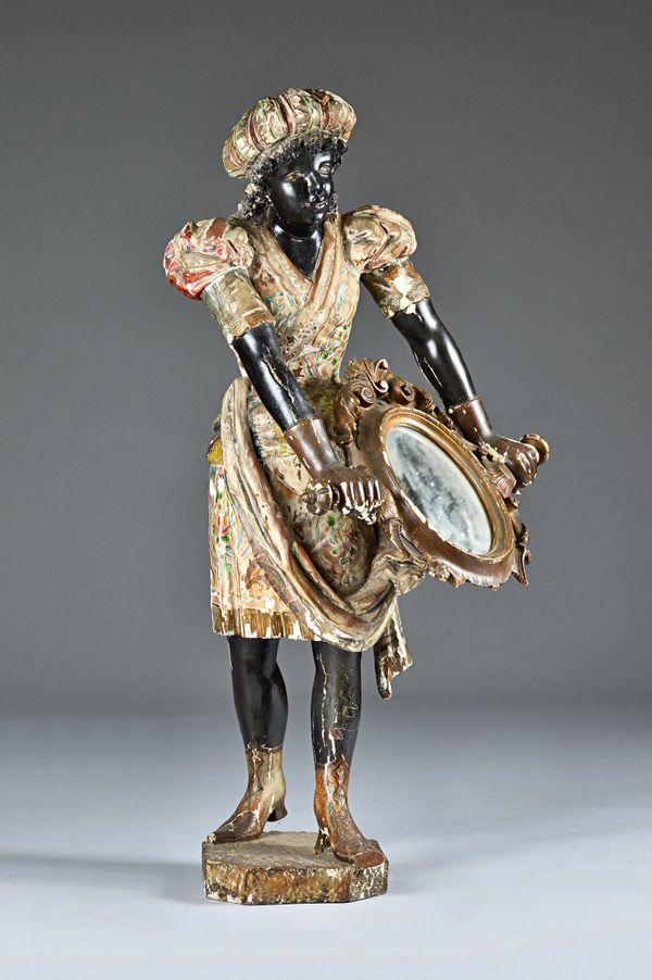 A late 19th century Italian polychrome painted blackamore figure of a women holding a mirror, 106cm high.