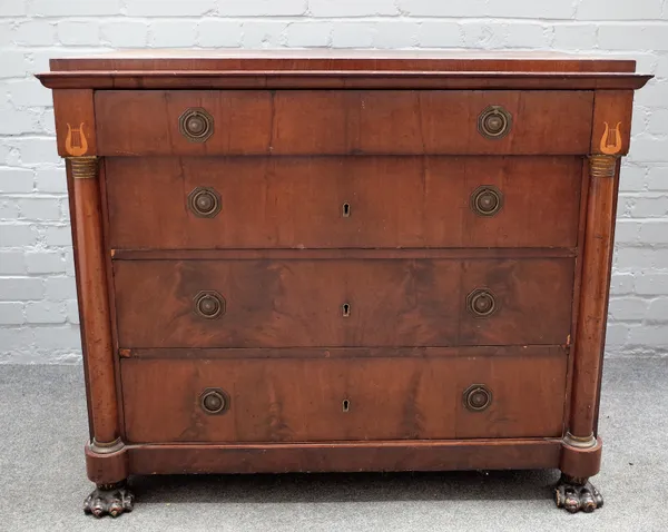 An early 19th century continental mahogany chest of four long graduated drawers flanked by split columns on paw feet, 108cm wide x 98cm high.