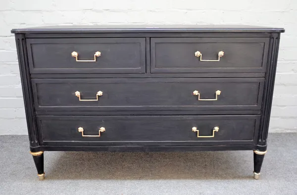 An ebonised Louis XVI style commode with two short and two long drawers flanked by reeded columns, 116cm wide x 74cm high.