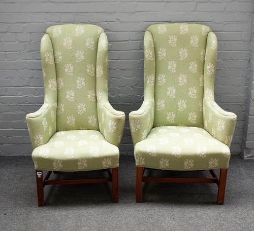 A pair of early 18th century style high wingback armchairs, on block mahogany supports, 70cm wide x 122cm high.
