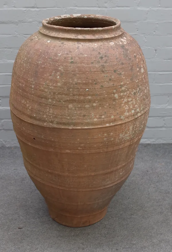 A terracotta oil jar, with ribbed baluster body, 95cm high x 55cm diameter.