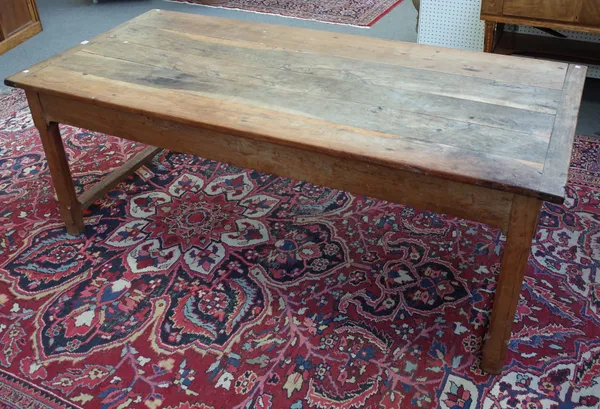 A 19th century French fruitwood kitchen table, the plank top over end frieze drawers on canted block supports, 94cm wide x 200cm long.