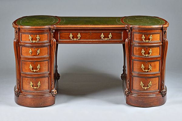 A George III style pedestal desk, with rounded ends and nine drawers about the knee, 154cm wide x 91cm deep.