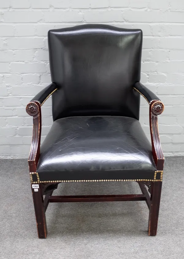 A George III style mahogany framed Gainsborough chair, on block supports, 67cm wide x 100cm high.