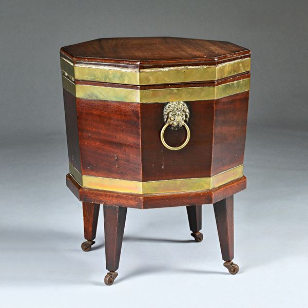 A George III mahogany brass bound octagonal cellarette on square supports, 49cm wide x 56cm high.