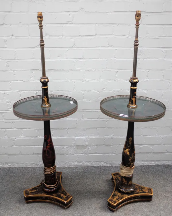 A pair of mid-20th century black lacquer Chinese decorated standard lamps, with galleried platform on triform bases, 39cm diameter x 120cm high.