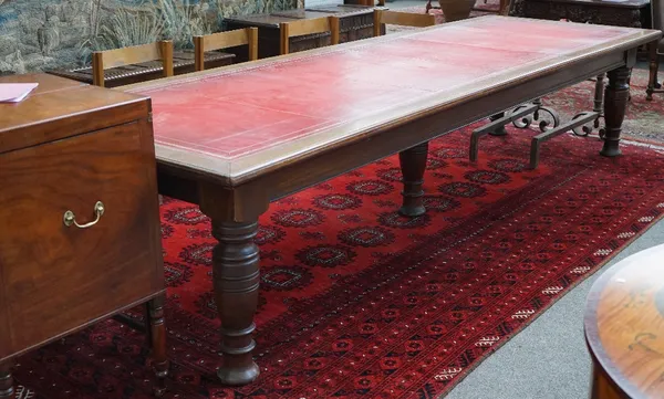 A large Victorian mahogany library table, the leather inset top over plain frieze on five turned supports, 120cm wide x 365cm long.