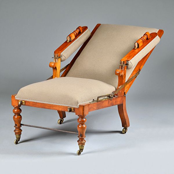 J.ALDERMAN; a Victorian satin birch reclining open armchair on turned supports, 70cm wide x 107cm high.