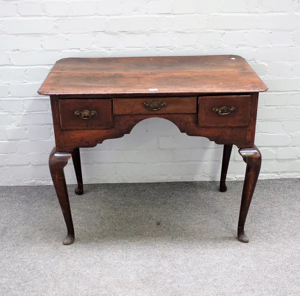 An 18th century oak low boy with three frieze drawers on cabriole supports, 88cm wide x 71cm high.