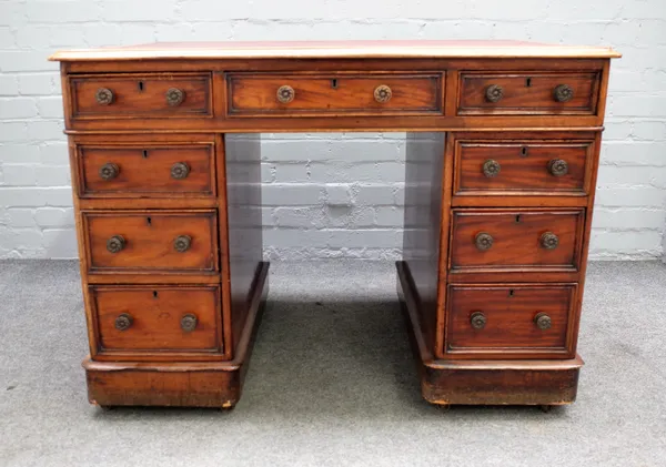 A late Victorian mahogany pedestal desk with nine drawers about the knee, 108cm wide x 68cm deep.