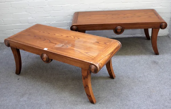 A pair of mid-18th century style oak window seats with turned end stops on splayed supports, each 112cm wide x 44cm high.