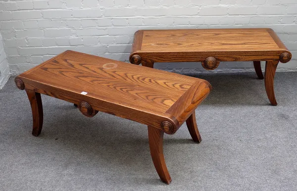 A pair of mid-18th century style oak window seats with turned end stops on splayed supports, each 112cm wide x 44cm high.