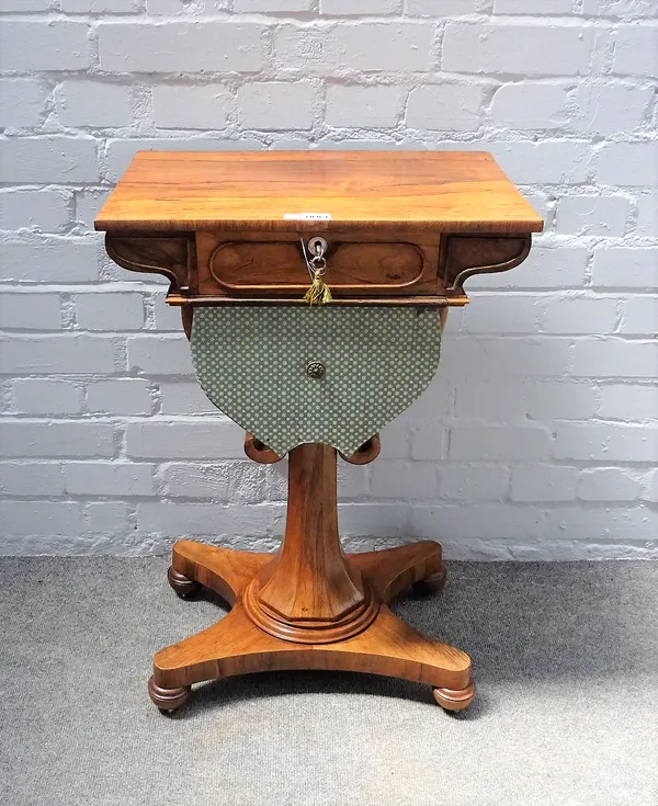 A William IV rosewood sewing table, with single drawer on flared octagonal column and quatrefoil base, 49cm wide x 73cm high.