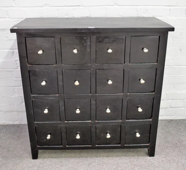 A 20th century ebonised apothecary cabinet with four rows of four drawers on block feet, 90cm wide x 91cm high.