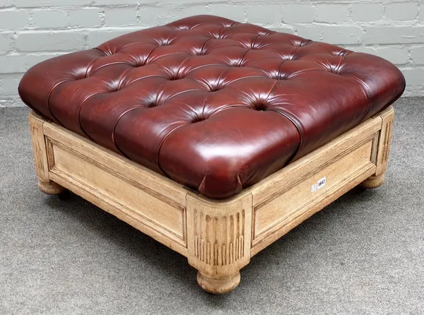 A bleeched oak rectangular footstool with leather upholstered overstuffed top, 75cm wide x 38cm high.