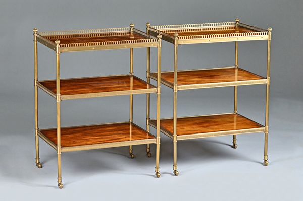 A pair of 20th century brass mounted mahogany two tier etageres, on turned supports, 53cm wide x 71cm high, (2).