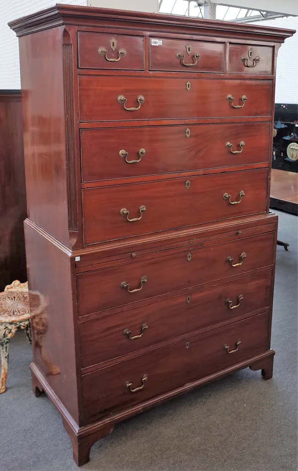 A George III mahogany chest on chest with three short over six long graduated drawers, divided by brushing slide, 117cm wide x 184cm high.