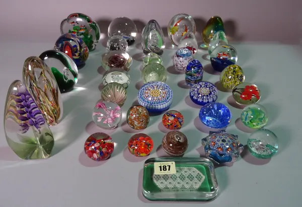 A large quantity of mostly 20th century glass paperweights of various sizes and designs, (36).