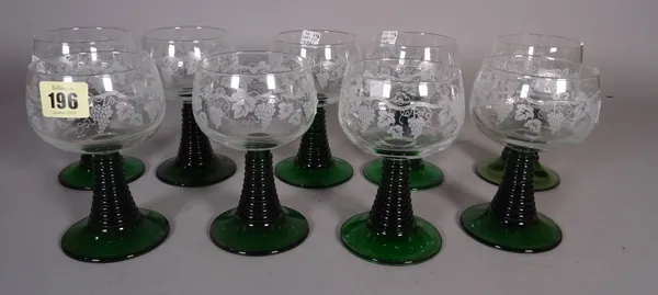 Glassware comprising; a suite of modern drinking vessels, with etched fruiting vine decoration and reverse tapering ribbed stems, (qty).