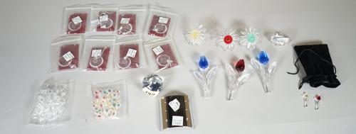 Swarovski, a quantity of mixed items including eight necklaces, a swan, six flowers, a bag of further smaller flowers and a paperweight, (qty).