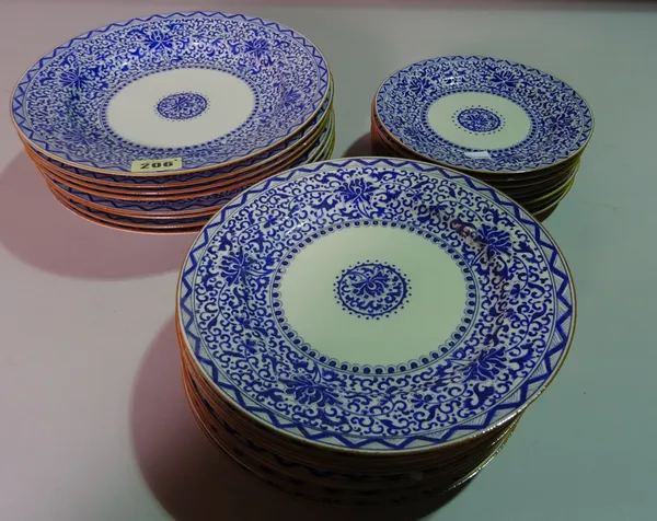 A set of 20th century Asian blue and white dining plates with textured decoration, (24).