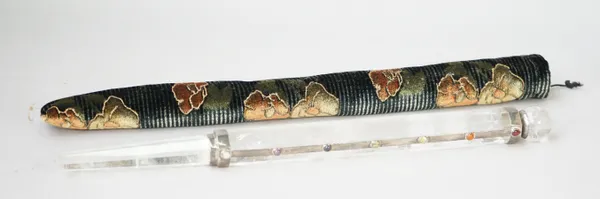 A silver coloured metal and cabochon gemstone mounted faceted rock crystal wand, having a spherical terminal, the mount set with seven cabochon gemsto