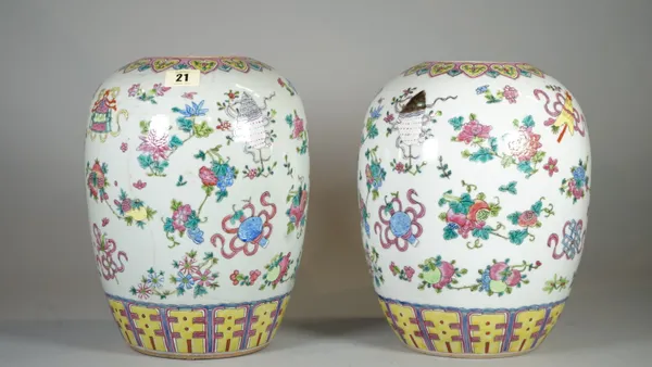 A pair of early 20th century Chinese vases, (lacking covers), decorated with Buddhist symbols, 29cm high, (2).