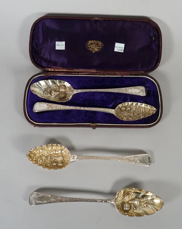 Two pairs of Victorian decorated berry or fruit serving spoons, with embossed and chased decoration, with four differing earlier hallmarks, combined w