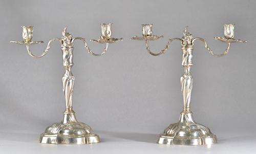 A pair of German twin light table candelabra, the candlesticks with mark of Johann (Hans) Jakob Baur V and the branches with the mark of Johann Philip