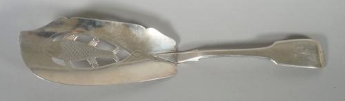A George III silver fiddle pattern fish slice, with engraved and pierced decoration, depicting a fish, Exeter 1814, maker possibly William Welch II, w