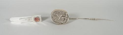 A Victorian silver book marker, the handle fitted with a magnifying lens and enclosing a miniature book, 'The Smallest French & English Dictionary In