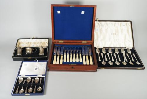 A set of twelve silver grapefruit spoons, London 1935, with a case, a set of six silver teaspoons, Sheffield 1975, with a case, a silver three piece c