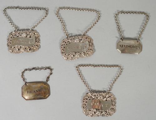 A set of three silver decanter labels, comprising; Madeira, Claret and Port, each in a scrolling design within a pierced, floral and foliate border, B