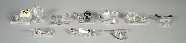 Swarovski, a group of ten crystal figures of sports related models, (10), (boxed).