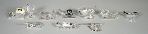 Swarovski, a group of ten crystal figures of sports related models, (10), (boxed).